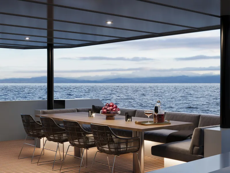 Slide: The Image of Luxurious yacht deck with dining area, ocean view; Custom Tufan and Brothers Mako Shark, 2027. - 4