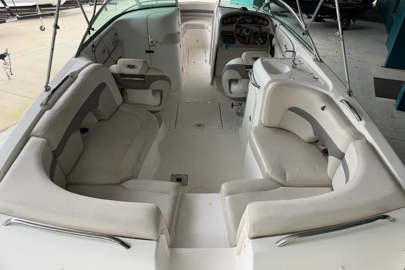 Slide: The Image of 2006 Chaparral 260 SSi boat interior with spacious seating and modern dashboard. - 12