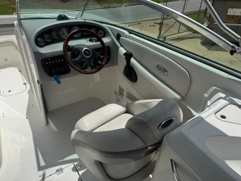 Slide: The Image of 2006 Chaparral 260 SSi boat cockpit with steering wheel and dashboard controls. - 4