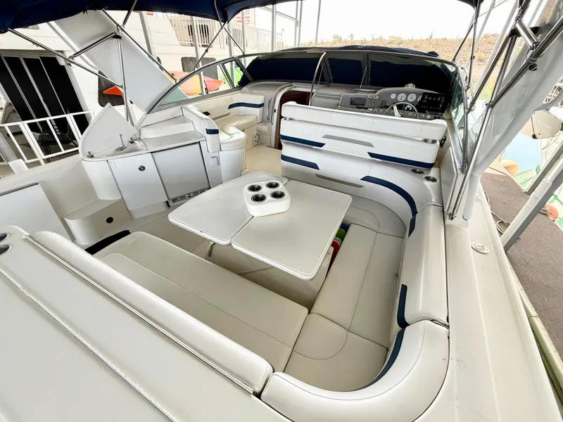 Slide: The Image of 1999 Formula 41 PC yacht interior with white seating and table, featuring a sleek design. - 10