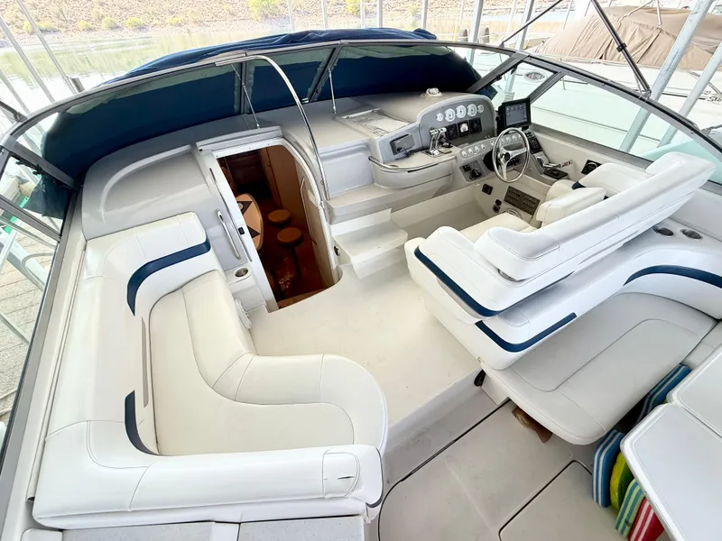 Slide: The Image of 1999 Formula 41 PC yacht interior with white seating and control panel. - 11