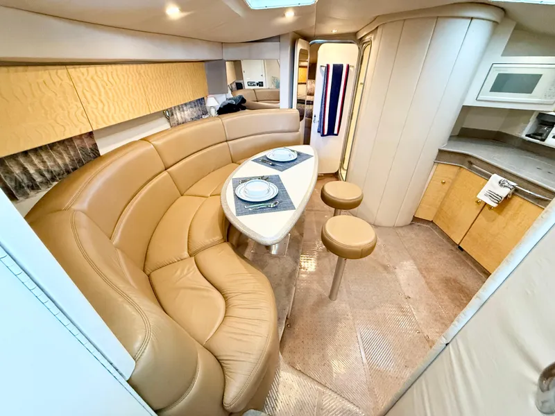 Slide: The Image of Luxurious 1999 Formula 41 PC yacht interior with leather seating and modern kitchen amenities. - 13