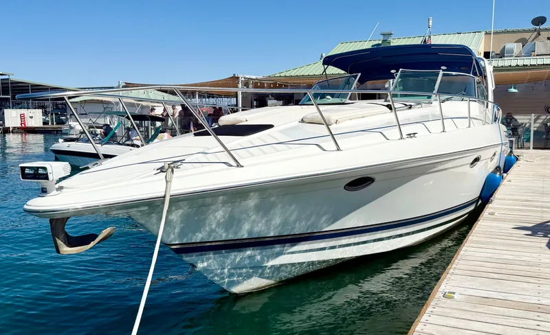 Slide: The Image of 1999 Formula 41 PC yacht docked at marina, sunny day, clear water. - 2