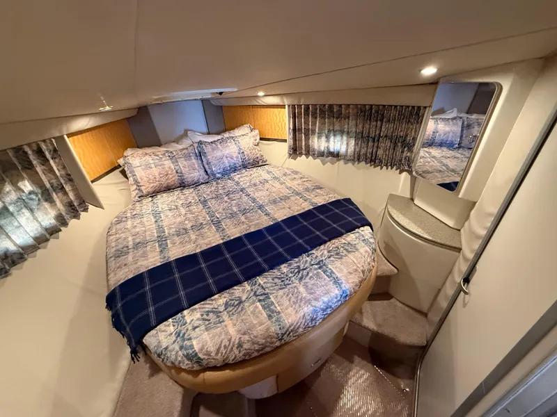 Slide: The Image of 1999 Formula 41 PC yacht cabin with cozy bed, patterned bedding, and elegant decor. - 20