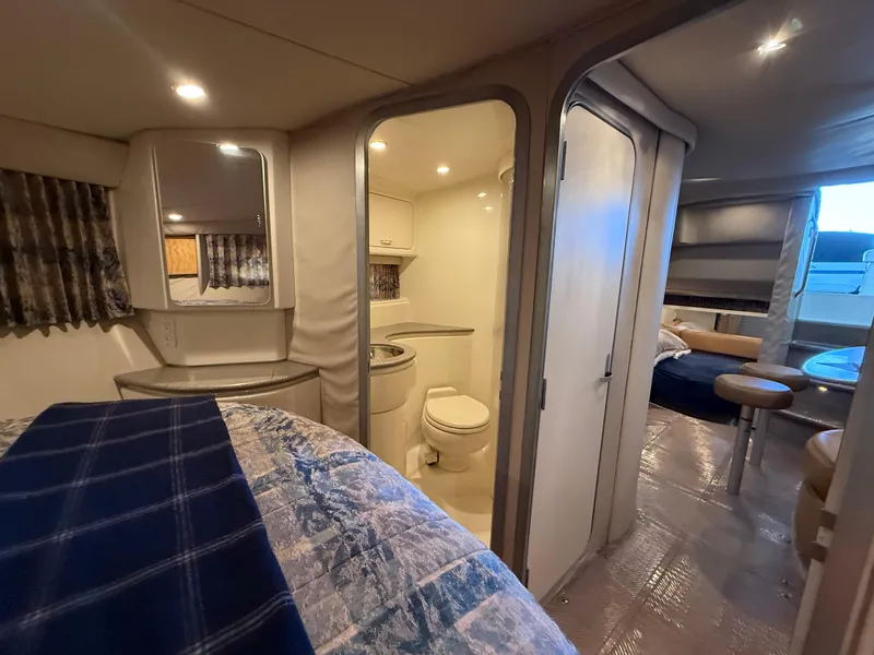 Slide: The Image of 1999 Formula 41 PC yacht interior with bedroom, bathroom, and seating area. - 22