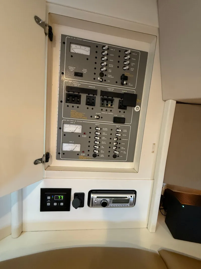 Slide: The Image of Electrical control panel inside a 1999 Formula 41 PC boat cabin. - 24