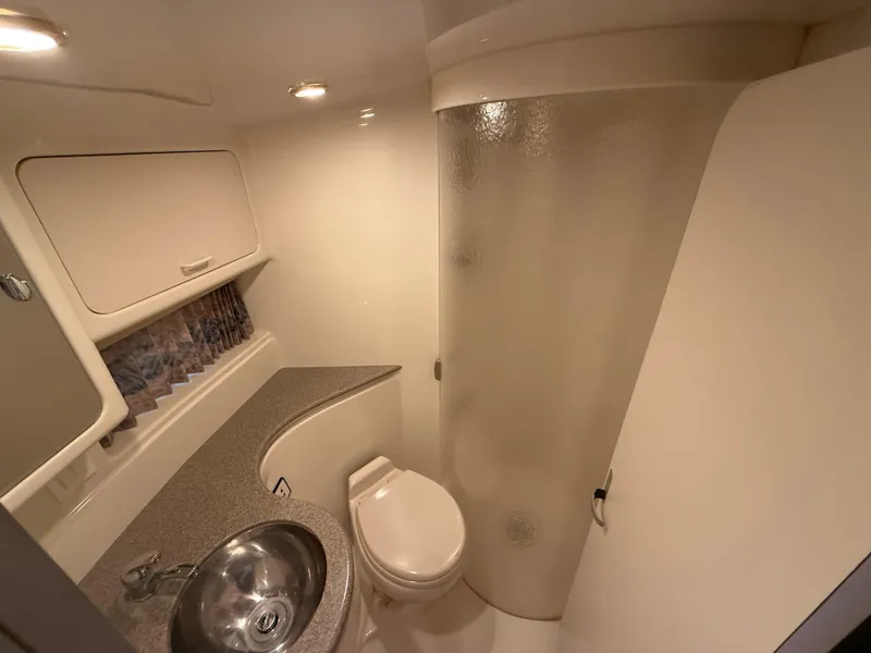 Slide: The Image of 1999 Formula 41 PC yacht bathroom with sink, toilet, and shower. - 26