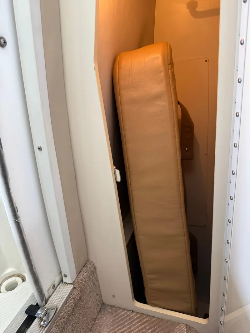 Slide: The Image of 1999 Formula 41 PC interior storage with beige cushion. - 27