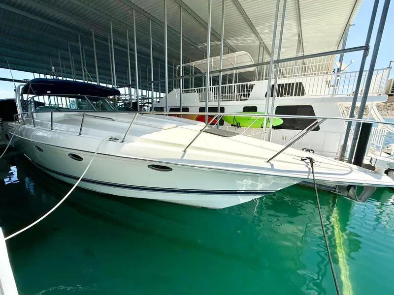 Slide: The Image of 1999 Formula 41 PC yacht docked in marina under covered shelter. - 36