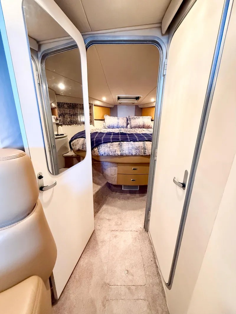 Slide: The Image of Interior cabin of a 1999 Formula 41 PC yacht with a cozy bed. - 7