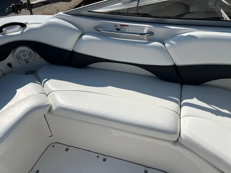 Slide: The Image of 2006 Yamaha Boats SX210 interior seating with white and black upholstery. - 14