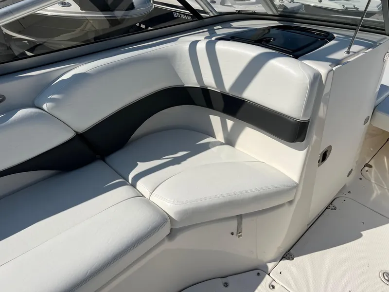 Slide: The Image of 2006 Yamaha Boats SX210 interior seating with white and black upholstery. - 15