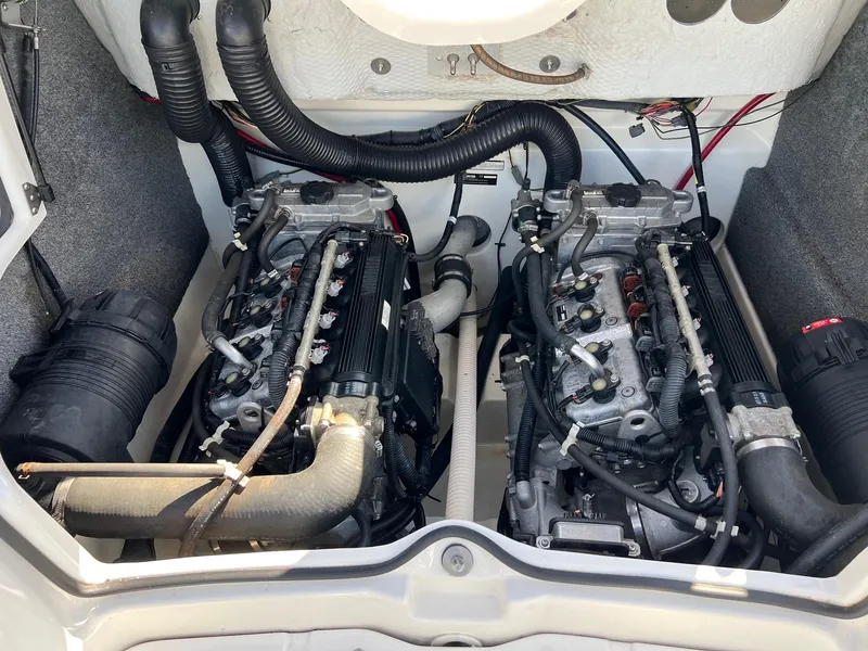 Slide: The Image of 2006 Yamaha Boats SX210 engine compartment with dual engines and wiring. - 17