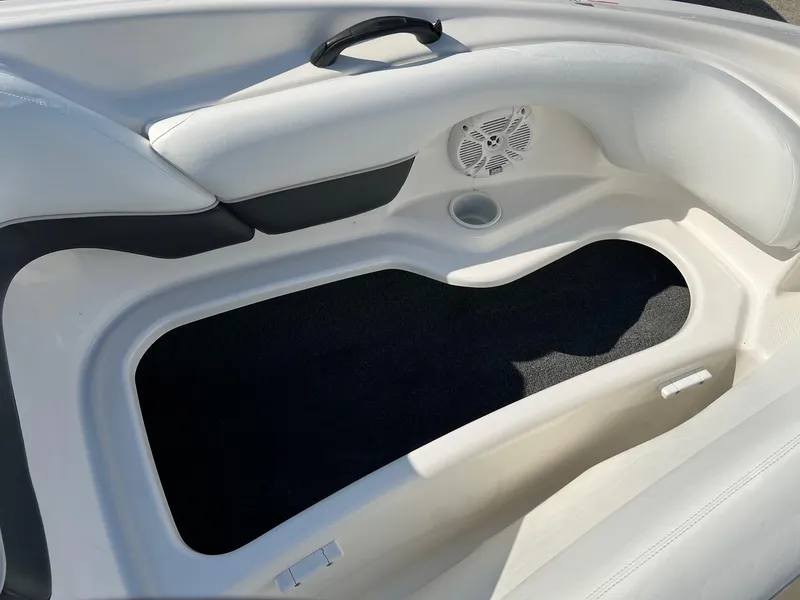 Slide: The Image of 2006 Yamaha SX210 boat interior with speaker and storage compartment. - 3