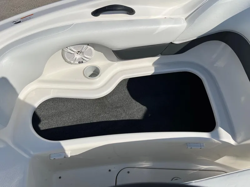 Slide: The Image of 2006 Yamaha SX210 boat interior with speaker and storage compartment. - 5