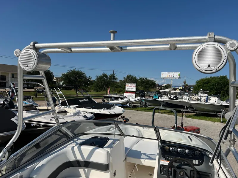 Slide: The Image of 2006 Yamaha Boats SX210 with speakers and control panel, displayed outdoors under clear blue sky. - 9