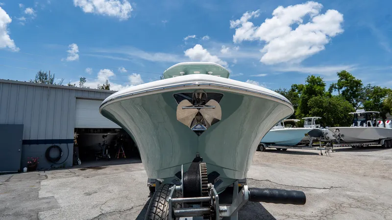 Slide: The Image of 2020 Tidewater 232 LXF boat on trailer under a clear blue sky. - 3