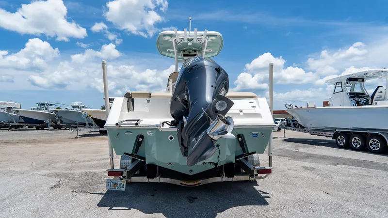 Slide: The Image of 2020 Tidewater 232 LXF boat with outboard motor, parked on a sunny day. - 5