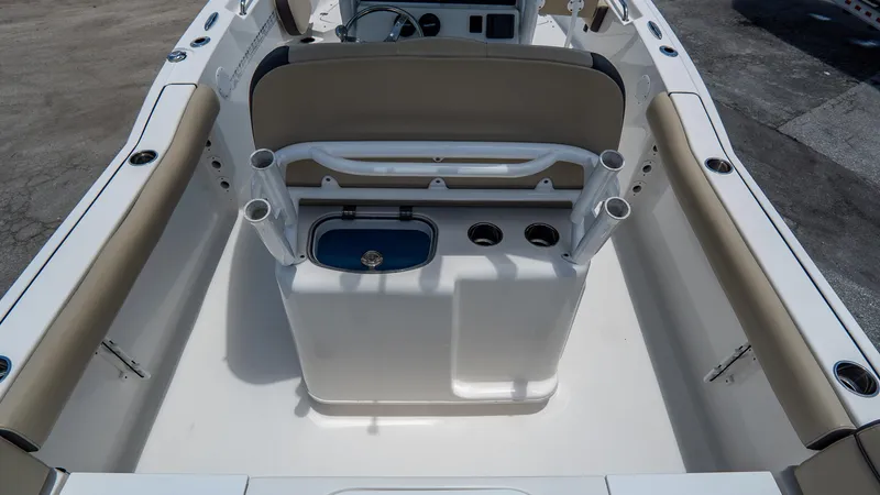 Slide: The Image of 2020 Tidewater 232 LXF boat interior with seating and fishing rod holders. - 8
