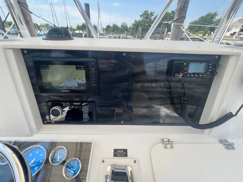 Slide: The Image of Dashboard of 2003 Shamrock 220 Cuddy with Garmin GPS and radio equipment. - 11