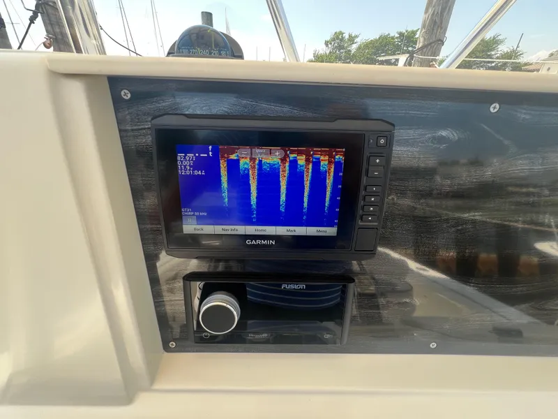Slide: The Image of Garmin fishfinder display on 2003 Shamrock 220 Cuddy boat dashboard. - 12