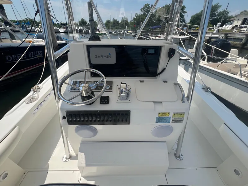 Slide: The Image of 2003 Shamrock 220 Cuddy boat dashboard with Garmin navigation system at marina. - 9