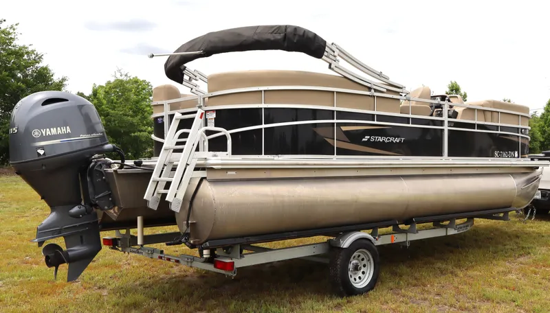 Slide: The Image of 2021 Starcraft LX 22 R pontoon boat on trailer with Yamaha outboard motor. - 3
