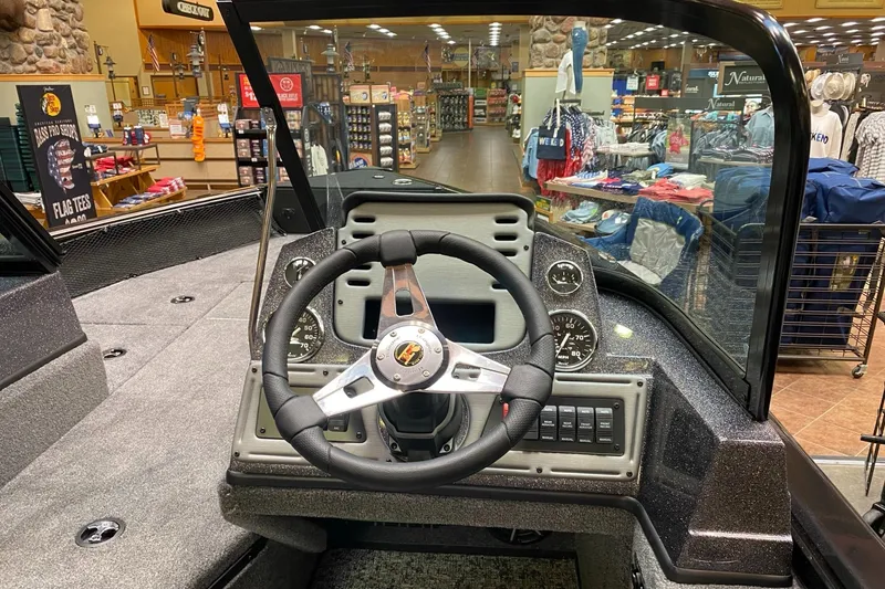 Slide: The Image of 2025 Ranger VS1682SC Angler boat dashboard in a showroom setting. - 1
