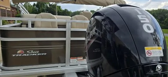 Slide: The Image of 2025 Sun Tracker SportFish 22 DLX pontoon boat with powerful 150 HP engine. - 4