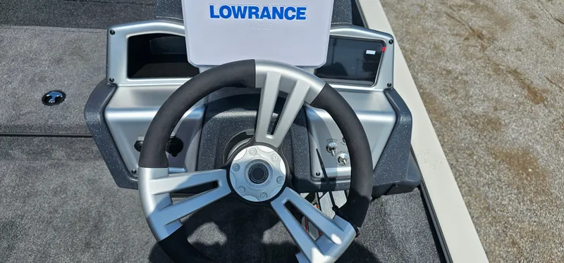 Slide: The Image of Steering wheel of 2025 Tracker Savage 215 boat with Lowrance display. - 10