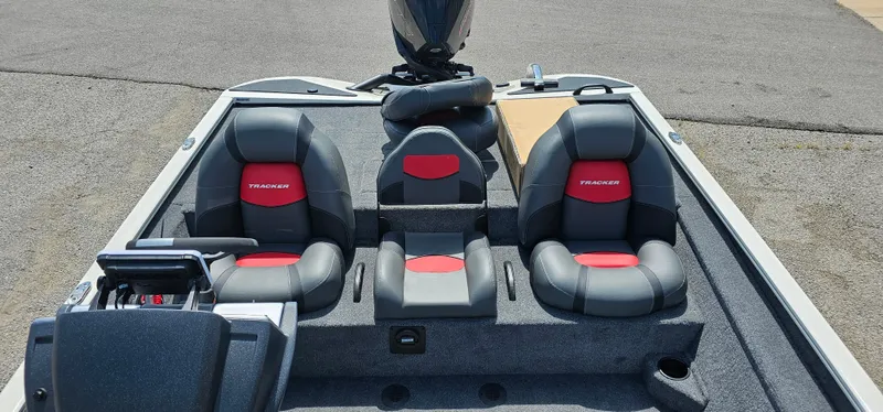 Slide: The Image of 2025 Tracker Savage 215 boat interior with dual seats and steering console. - 9