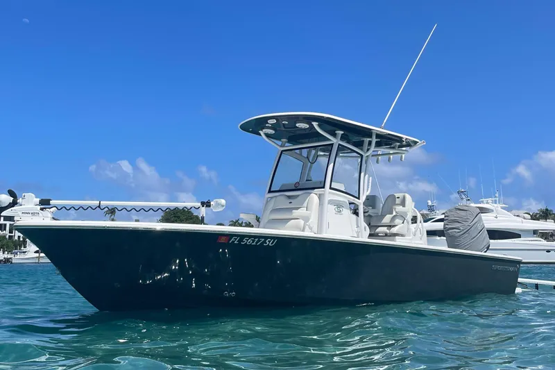 The Image of 2020 Sportsman Masters 267OE Bay Boat on clear blue water under sunny sky. - 0