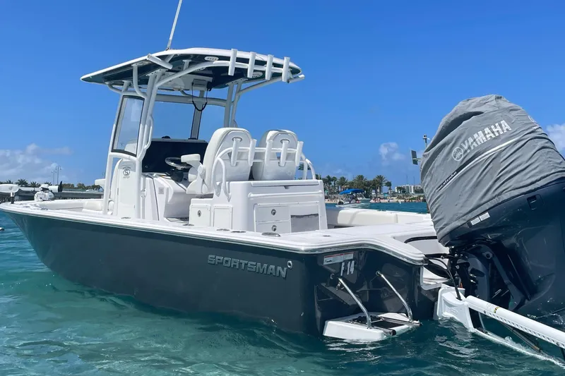 Slide: The Image of 2020 Sportsman Masters 267OE Bay Boat on clear water, featuring Yamaha engine. - 1