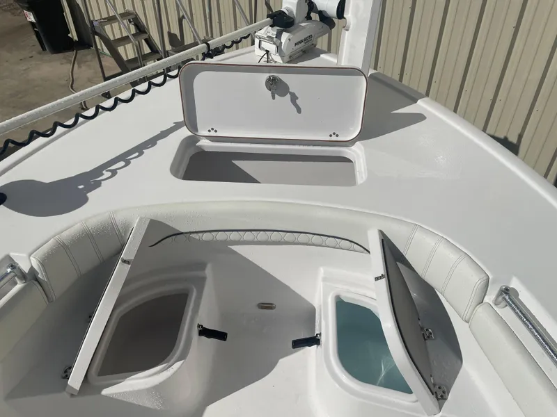 Slide: The Image of 2020 Sportsman Masters 267OE Bay Boat with open storage compartments. - 4