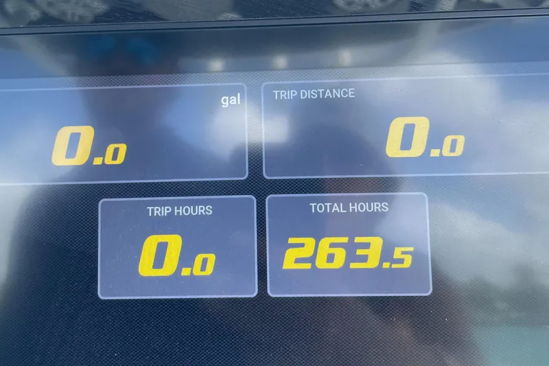 Slide: The Image of Dashboard display of a 2020 Sportsman Masters 267OE Bay Boat showing trip and total hours. - 8