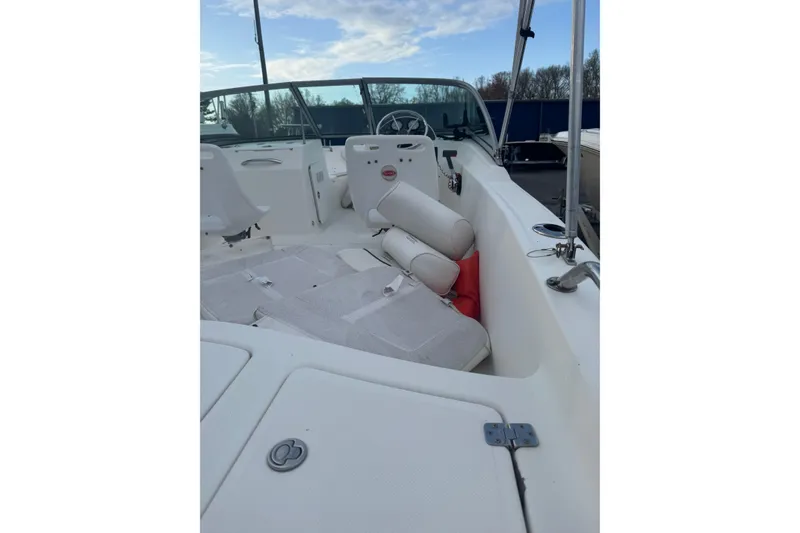Slide: The Image of 2009 Pioneer 175 Venture boat interior with white seating and steering wheel. - 10