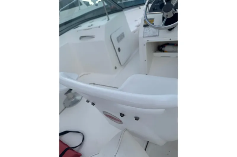 Slide: The Image of Interior view of a 2009 Pioneer 175 Venture boat, featuring steering wheel and seating. - 13