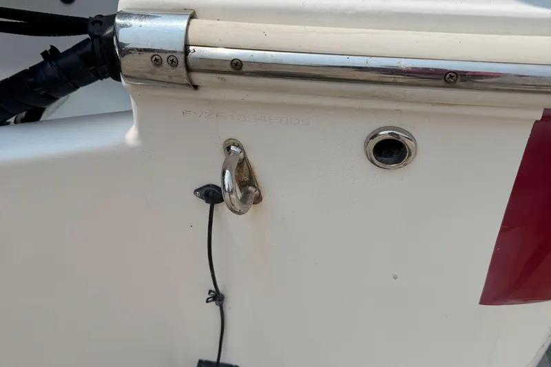 Slide: The Image of 2009 Pioneer 175 Venture boat on trailer with Yamaha engine, parked outdoors. - 2