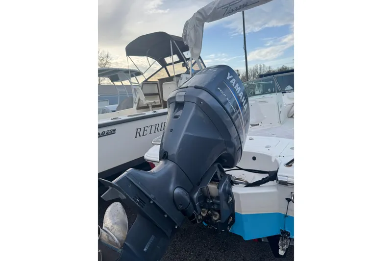 Slide: The Image of 2009 Pioneer 175 Venture boat with Yamaha outboard motor, docked outdoors. - 8