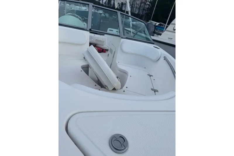 Slide: The Image of Interior view of a 2009 Pioneer 175 Venture boat, showcasing seating and deck details. - 9