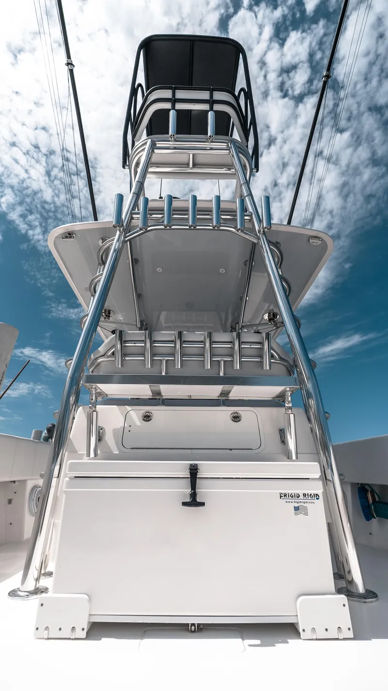 Slide: The Image of 2023 Contender 39 ST boat with tower against a blue sky backdrop. - 22