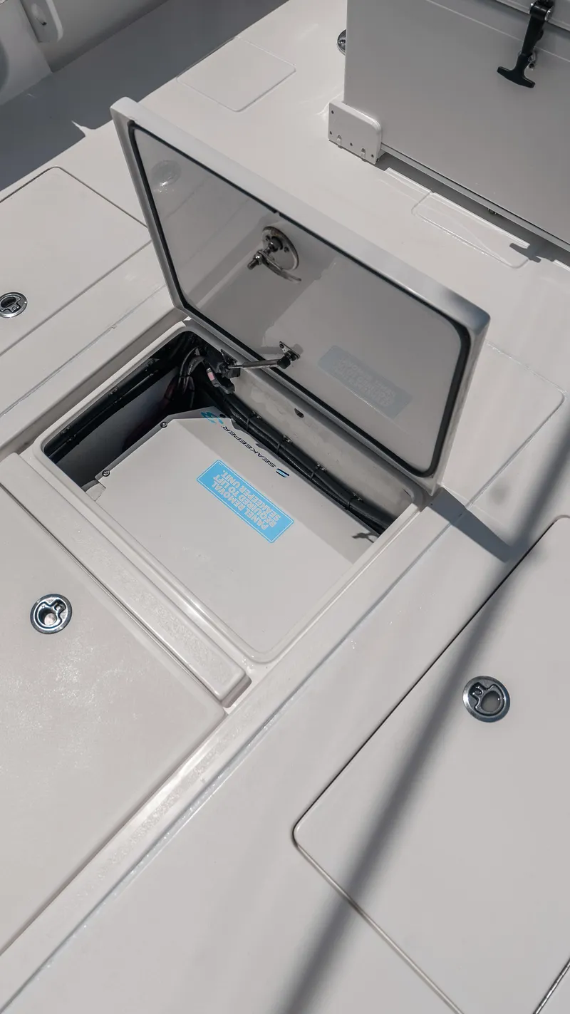 Slide: The Image of 2023 Contender 39 ST boat storage compartment with open hatch. - 29