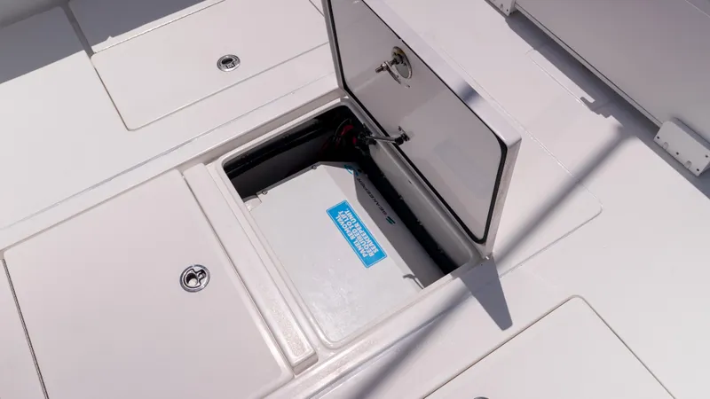 Slide: The Image of Open storage compartment on 2023 Contender 39 ST boat deck. - 37
