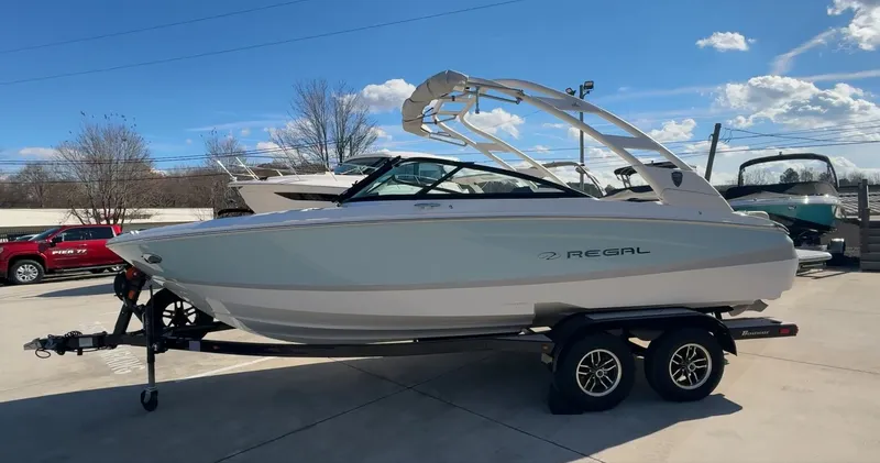 Slide: The Image of 2026 Regal LS2 Ultimate boat on trailer in sunny weather. - 7