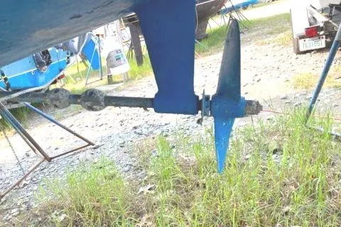 Slide: The Image of Propeller and rudder of a 2002 Hunter 326 sailboat on land. - 12