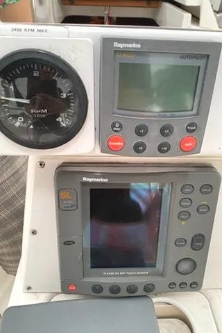 Slide: The Image of Control panel of a 2002 Hunter 326 sailboat with Raymarine instruments. - 25