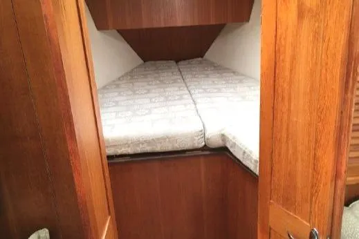 Slide: The Image of Cozy cabin interior with twin beds in 2002 Hunter 326 sailboat. - 27