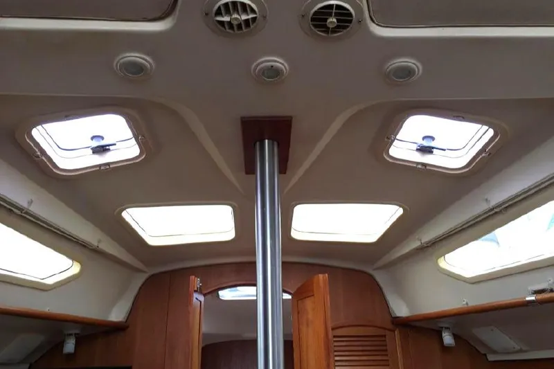 Slide: The Image of Interior view of 2002 Hunter 326 sailboat cabin ceiling with skylights. - 28