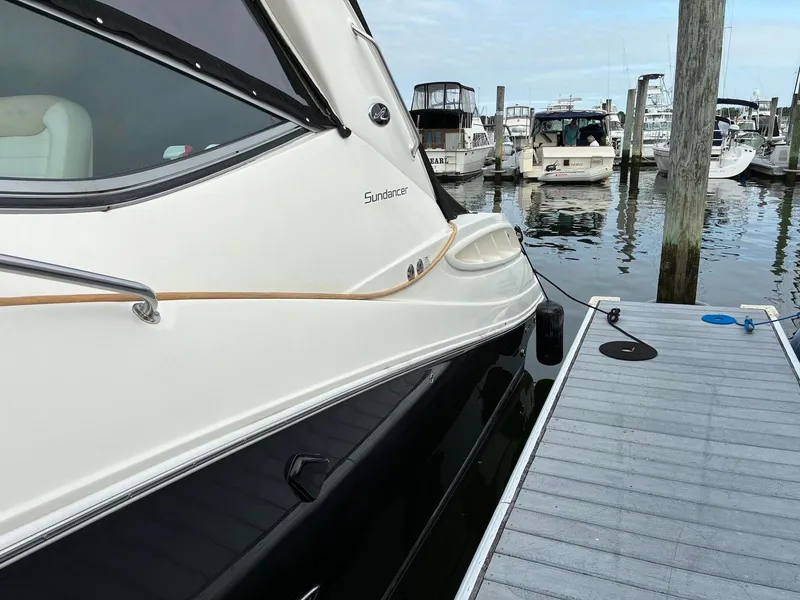 Slide: The Image of 2009 Sea Ray 330 Sundancer docked at marina, side view. - 30