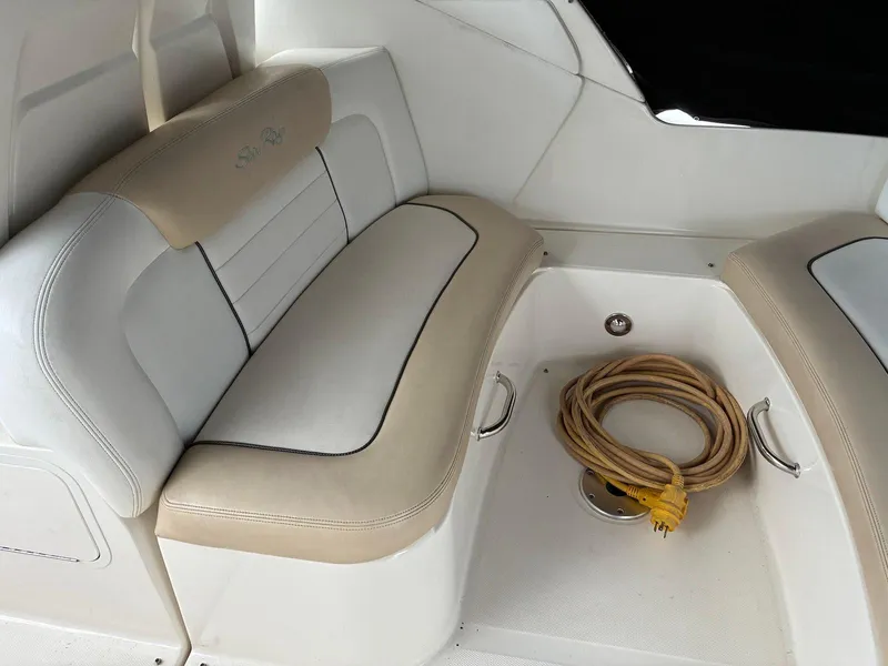 Slide: The Image of 2009 Sea Ray 330 Sundancer interior seating with coiled rope on deck. - 7
